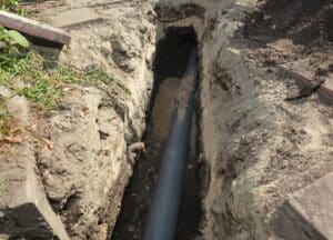 Installing sewer pipe